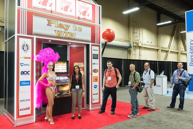 Huge promotional slot machine booth installation for trade show traffic